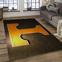 ncaa tennessee volunteers college sport basketball and foolball team logo rectangle area rug dark room tvs42